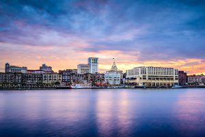 Savannah, Georgia, USA downtown skyline at the riverfront at dusk.