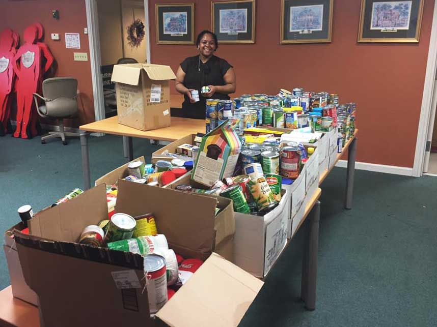 Boxes full of canned goods collected during food drive.