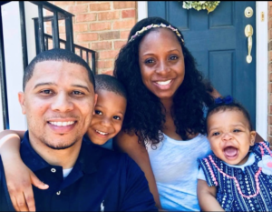 a family sitting on their front porch