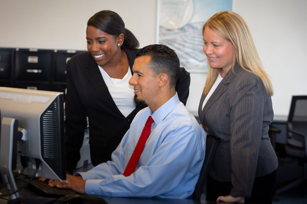 Workers looking at computer screens