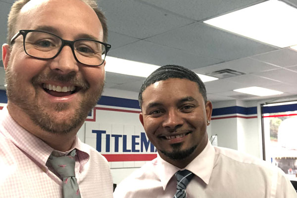 Two men in a TitleMax store
